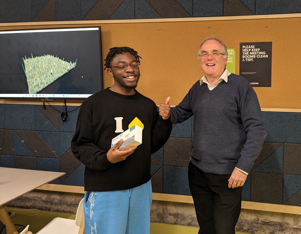Bow receiving his prize